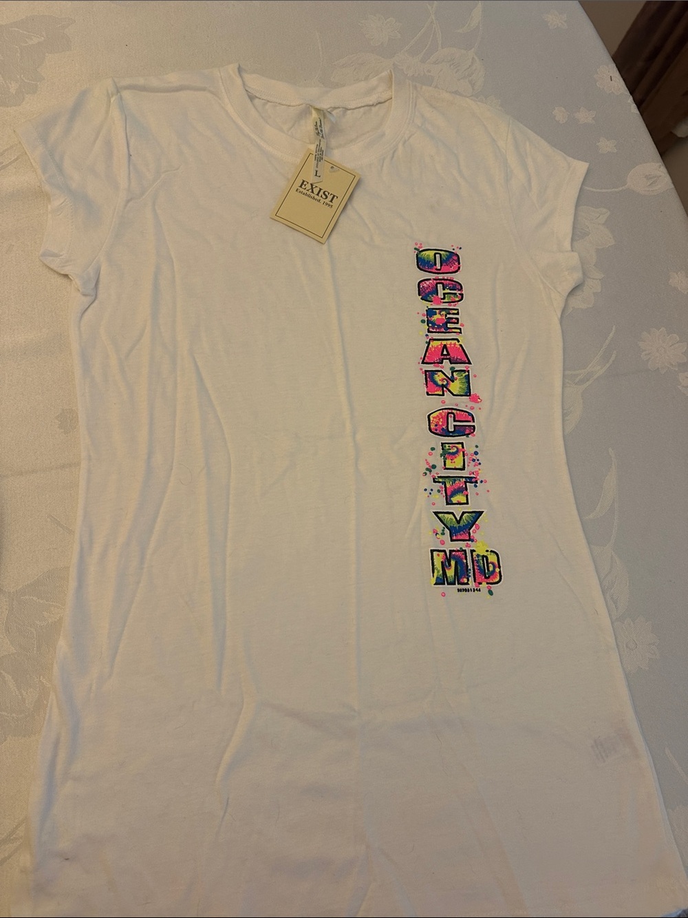 100% cotton Exist White Tee with Neon Multicolor Vertical 'OCEAN CITY MD' Logo